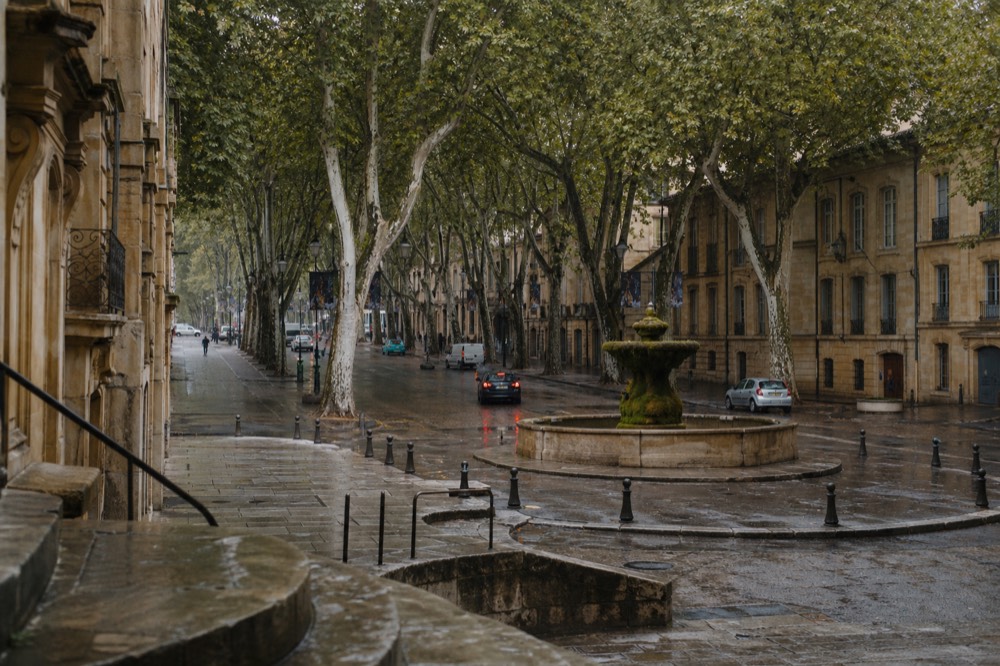Cours Mirabeau with plane trees and fountains, no text, no logos, no people