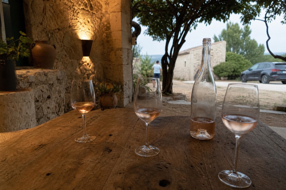 Tasting room with glasses and a bottle of rosé, no text, no logos, no people