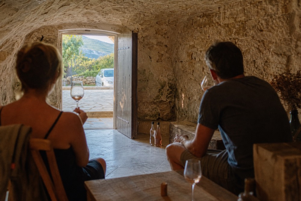 Wine tasting in a Côtes de Provence cellar, no text, no logos, no people