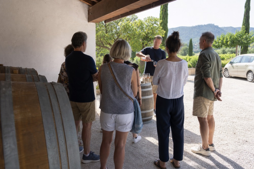 Half-day wine tour group at a cellar door near Aix, no text, no logos, no people
