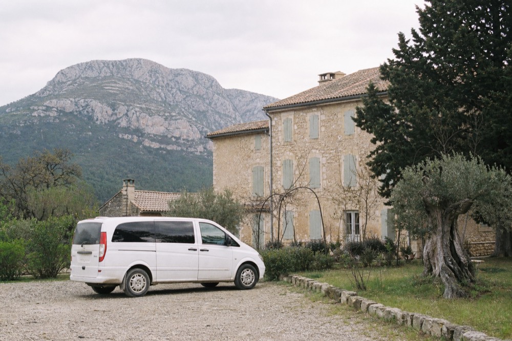 Private wine tour vehicle parked at a Provençal estate, no text, no logos, no people