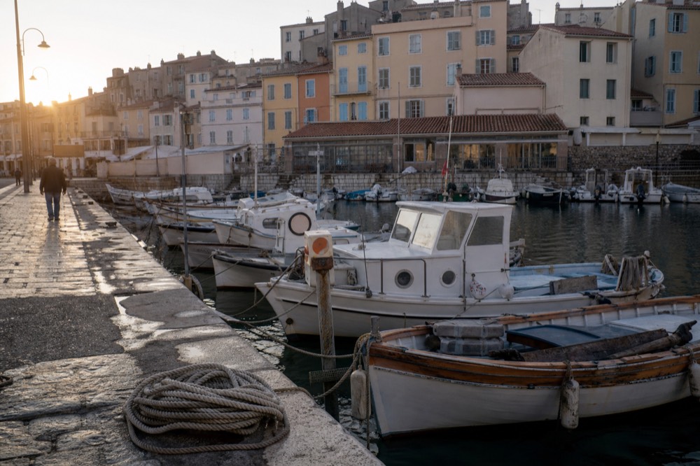 Harbour waterfront in Marseille with boats and morning light, no text, no logos, no people