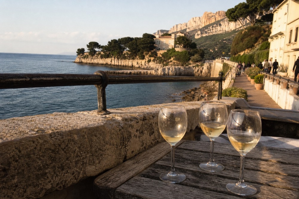 White wine glasses on a terrace above the sea near Cassis, no text, no logos, no people